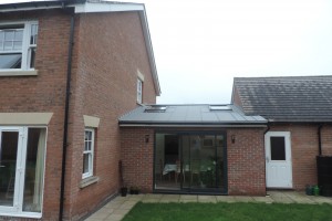 Linking the main house to the detached garage with dining room extension